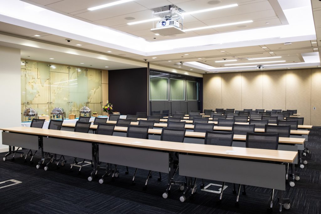 Conference Room 1A at One Rotary Place. Photo of a large conference room with a projector.