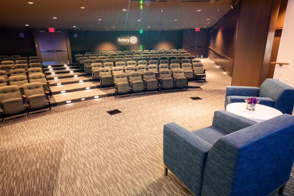 3rd Floor Auditorium at One Rotary Place. Photo of a large theater and stage featuring a stage that can be customized for events.